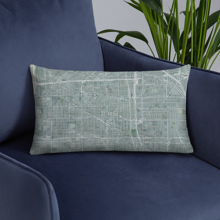 Custom Bellflower California Map Throw Pillow in Afternoon on Blue Colored Chair