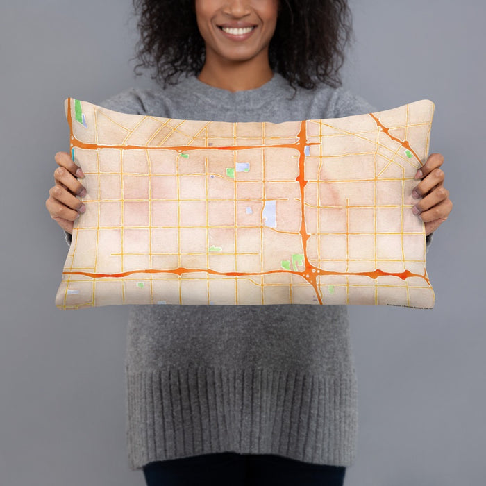 Person holding 20x12 Custom Bellflower California Map Throw Pillow in Watercolor