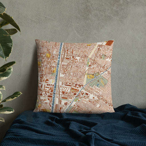 Custom Bell Gardens California Map Throw Pillow in Woodblock on Bedding Against Wall