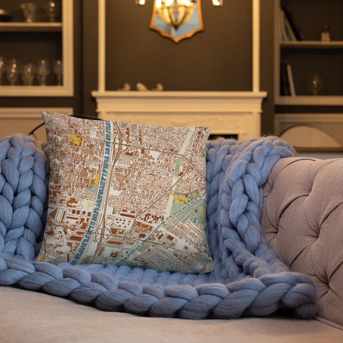 Custom Bell Gardens California Map Throw Pillow in Woodblock on Cream Colored Couch