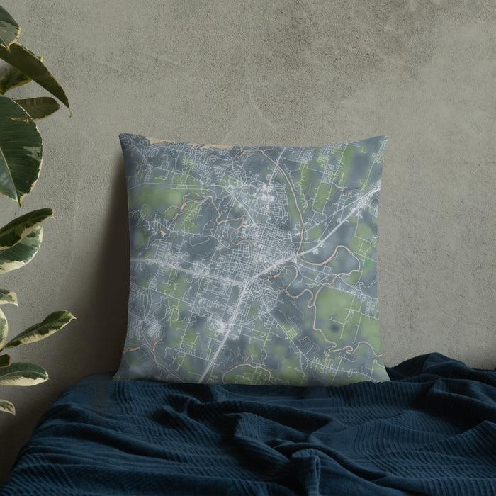 Custom Belton Texas Map Throw Pillow in Afternoon on Bedding Against Wall