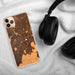 Custom Bend Oregon Map Phone Case in Ember on Table with Black Headphones