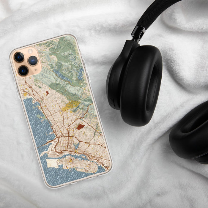 Custom Berkeley California Map Phone Case in Woodblock on Table with Black Headphones
