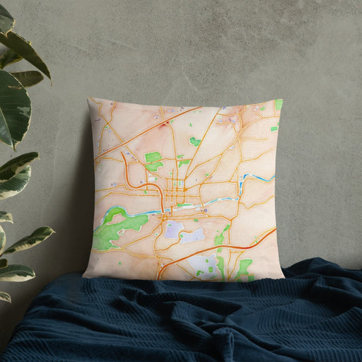Custom Bethlehem Pennsylvania Map Throw Pillow in Watercolor on Bedding Against Wall