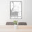 24x36 Bigfork Montana Map Print Portrait Orientation in Classic Style Behind 2 Chairs Table and Potted Plant