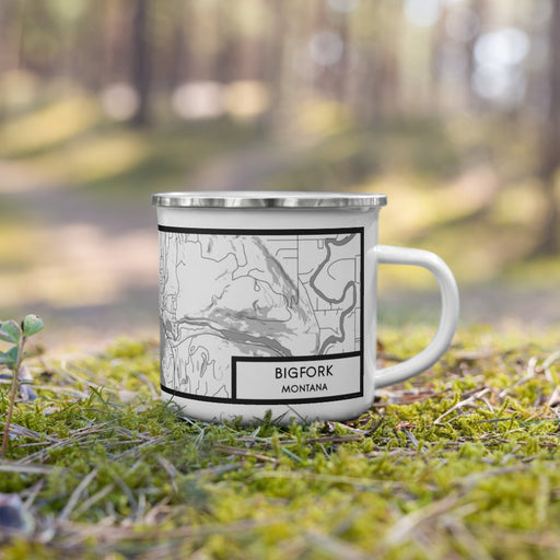 Right View Custom Bigfork Montana Map Enamel Mug in Classic on Grass With Trees in Background