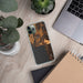 Custom Bigfork Montana Map Phone Case in Ember on Table with Laptop and Plant