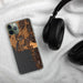 Custom Bigfork Montana Map Phone Case in Ember on Table with Black Headphones