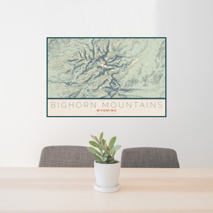 24x36 Bighorn Mountains Wyoming Map Print Lanscape Orientation in Woodblock Style Behind 2 Chairs Table and Potted Plant