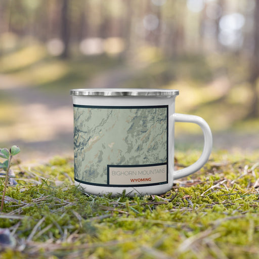 Right View Custom Bighorn Mountains Wyoming Map Enamel Mug in Woodblock on Grass With Trees in Background