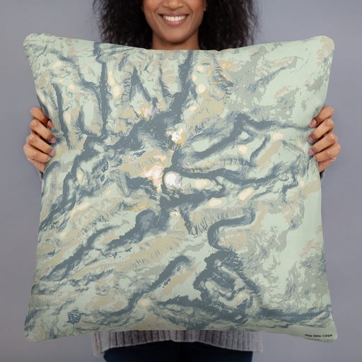 Person holding 22x22 Custom Bighorn Mountains Wyoming Map Throw Pillow in Woodblock