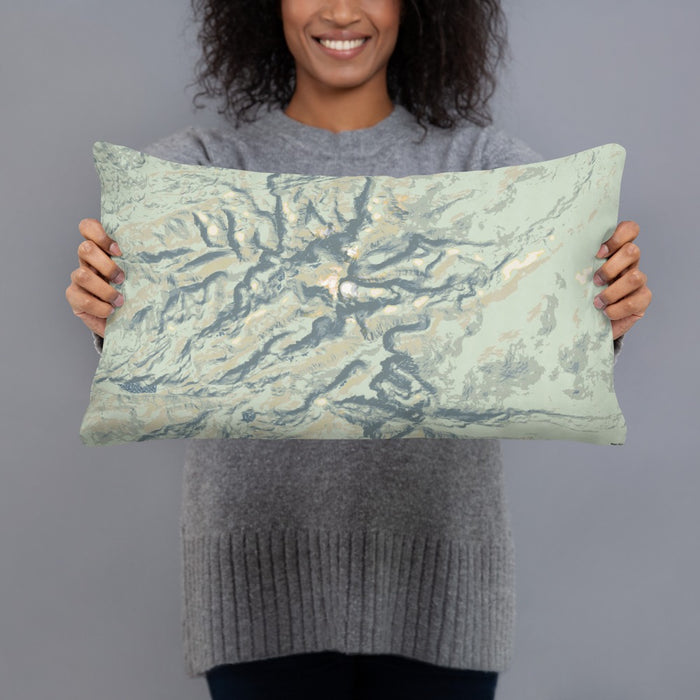 Person holding 20x12 Custom Bighorn Mountains Wyoming Map Throw Pillow in Woodblock