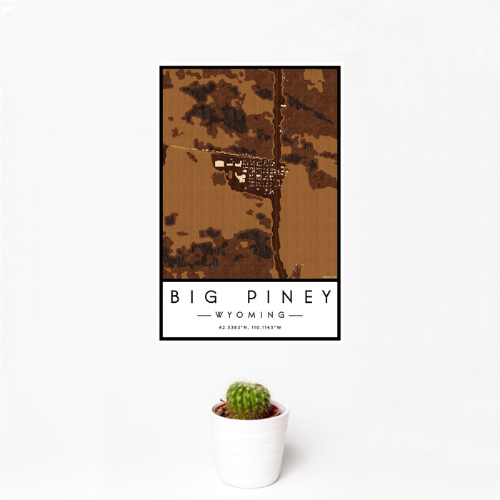 12x18 Big Piney Wyoming Map Print Portrait Orientation in Ember Style With Small Cactus Plant in White Planter