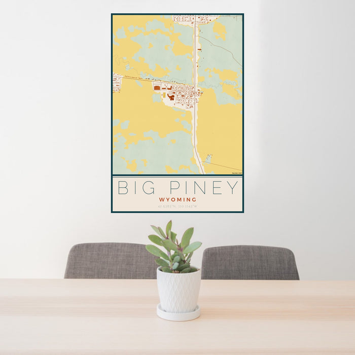 24x36 Big Piney Wyoming Map Print Portrait Orientation in Woodblock Style Behind 2 Chairs Table and Potted Plant