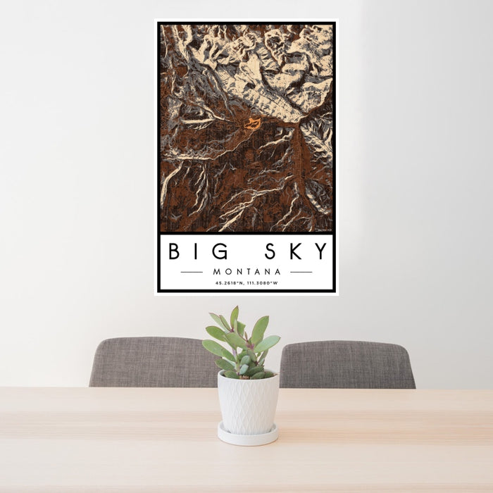 24x36 Big Sky Montana Map Print Portrait Orientation in Ember Style Behind 2 Chairs Table and Potted Plant