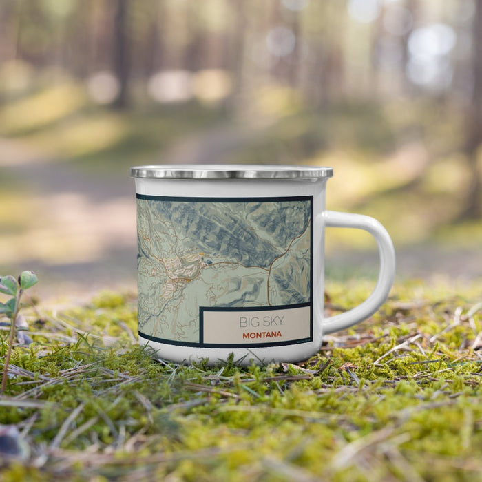 Right View Custom Big Sky Montana Map Enamel Mug in Woodblock on Grass With Trees in Background
