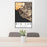 24x36 Big Sur California Map Print Portrait Orientation in Ember Style Behind 2 Chairs Table and Potted Plant