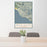 24x36 Big Sur California Map Print Portrait Orientation in Woodblock Style Behind 2 Chairs Table and Potted Plant