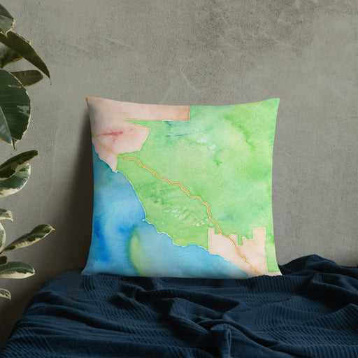 Custom Big Sur California Map Throw Pillow in Watercolor on Bedding Against Wall