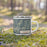 Right View Custom Big Sur California Map Enamel Mug in Woodblock on Grass With Trees in Background