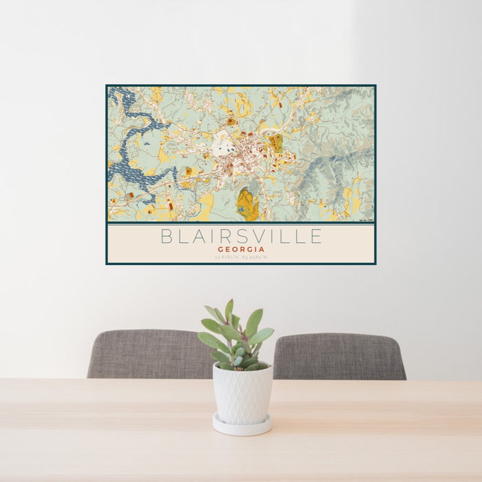 24x36 Blairsville Georgia Map Print Lanscape Orientation in Woodblock Style Behind 2 Chairs Table and Potted Plant