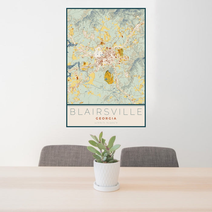 24x36 Blairsville Georgia Map Print Portrait Orientation in Woodblock Style Behind 2 Chairs Table and Potted Plant