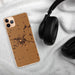 Custom Blissfield Michigan Map Phone Case in Ember on Table with Black Headphones
