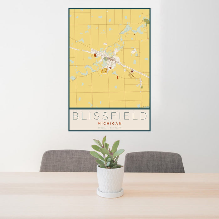 24x36 Blissfield Michigan Map Print Portrait Orientation in Woodblock Style Behind 2 Chairs Table and Potted Plant