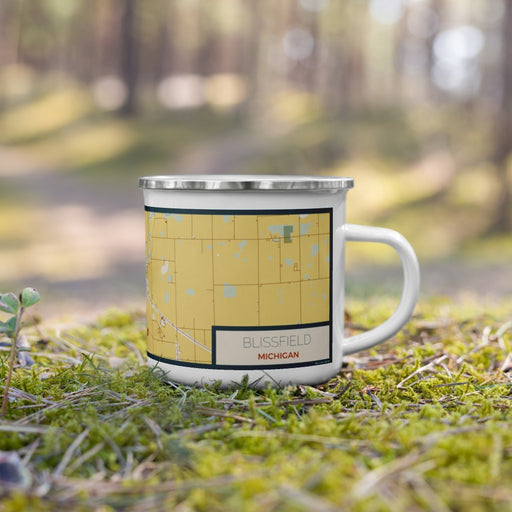 Right View Custom Blissfield Michigan Map Enamel Mug in Woodblock on Grass With Trees in Background