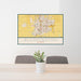 24x36 Bloomington Illinois Map Print Landscape Orientation in Woodblock Style Behind 2 Chairs Table and Potted Plant