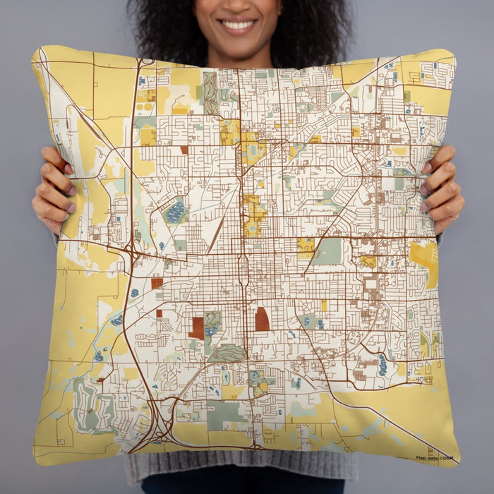 Person holding 22x22 Custom Bloomington Illinois Map Throw Pillow in Woodblock