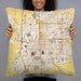 Person holding 22x22 Custom Bloomington Illinois Map Throw Pillow in Woodblock