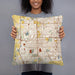 Person holding 18x18 Custom Bloomington Illinois Map Throw Pillow in Woodblock