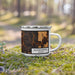 Right View Custom Bloomington Indiana Map Enamel Mug in Ember on Grass With Trees in Background