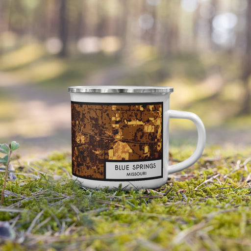 Right View Custom Blue Springs Missouri Map Enamel Mug in Ember on Grass With Trees in Background