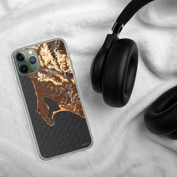 Custom Bodega Bay California Map Phone Case in Ember on Table with Black Headphones