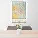 24x36 Boise Idaho Map Print Portrait Orientation in Woodblock Style Behind 2 Chairs Table and Potted Plant