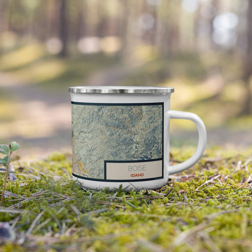 Right View Custom Boise Idaho Map Enamel Mug in Woodblock on Grass With Trees in Background