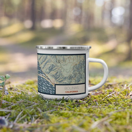 Right View Custom Bolinas California Map Enamel Mug in Woodblock on Grass With Trees in Background