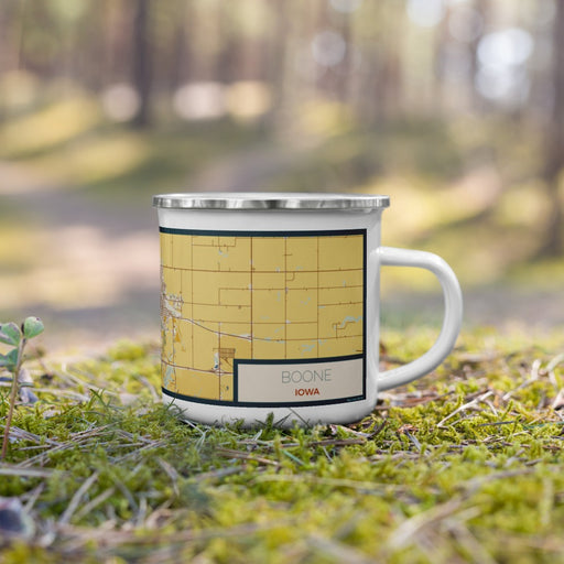 Right View Custom Boone Iowa Map Enamel Mug in Woodblock on Grass With Trees in Background