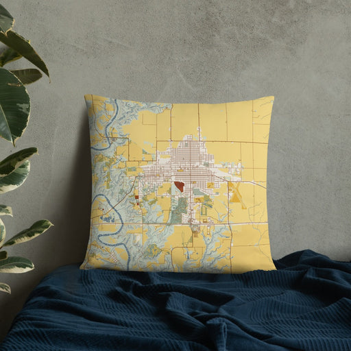 Custom Boone Iowa Map Throw Pillow in Woodblock on Bedding Against Wall