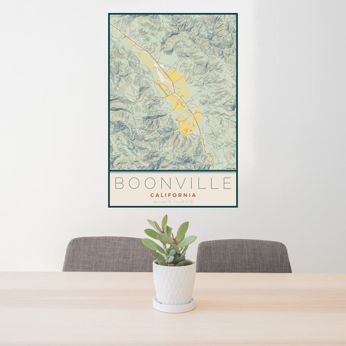 24x36 Boonville California Map Print Portrait Orientation in Woodblock Style Behind 2 Chairs Table and Potted Plant