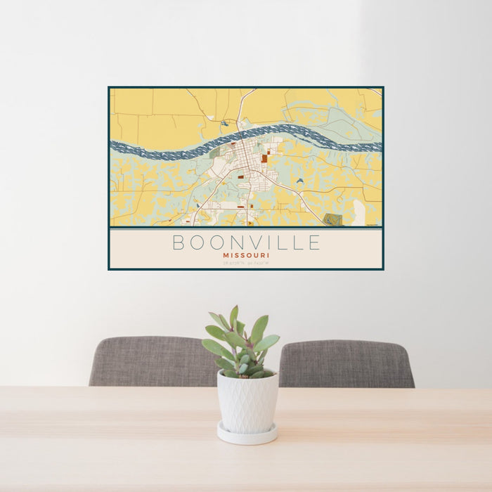 24x36 Boonville Missouri Map Print Landscape Orientation in Woodblock Style Behind 2 Chairs Table and Potted Plant