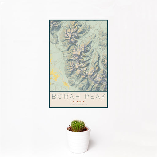 12x18 Borah Peak Idaho Map Print Portrait Orientation in Woodblock Style With Small Cactus Plant in White Planter