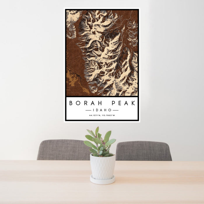 24x36 Borah Peak Idaho Map Print Portrait Orientation in Ember Style Behind 2 Chairs Table and Potted Plant