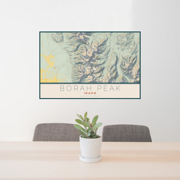 24x36 Borah Peak Idaho Map Print Lanscape Orientation in Woodblock Style Behind 2 Chairs Table and Potted Plant