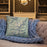 Custom Borah Peak Idaho Map Throw Pillow in Woodblock on Cream Colored Couch