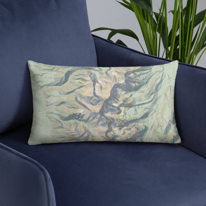 Custom Borah Peak Idaho Map Throw Pillow in Woodblock on Blue Colored Chair
