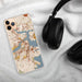 Custom Boston Massachusetts Map Phone Case in Woodblock on Table with Black Headphones