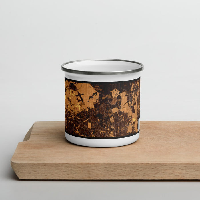 Front View Custom Bowie Maryland Map Enamel Mug in Ember on Cutting Board